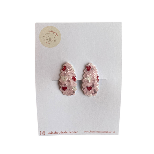 Pink/white hair clips with red hearts