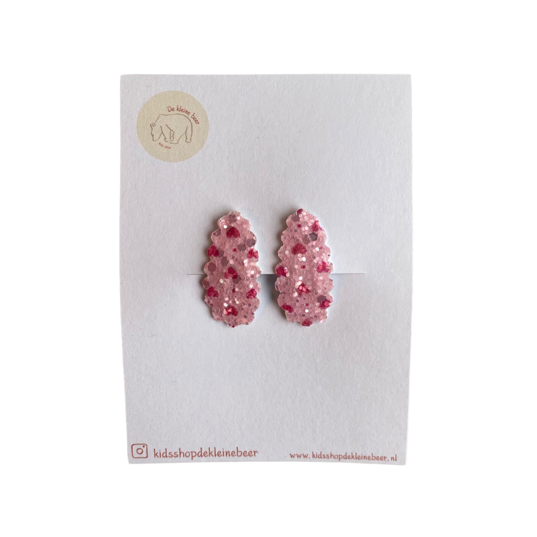 Pink hair clips with red hearts